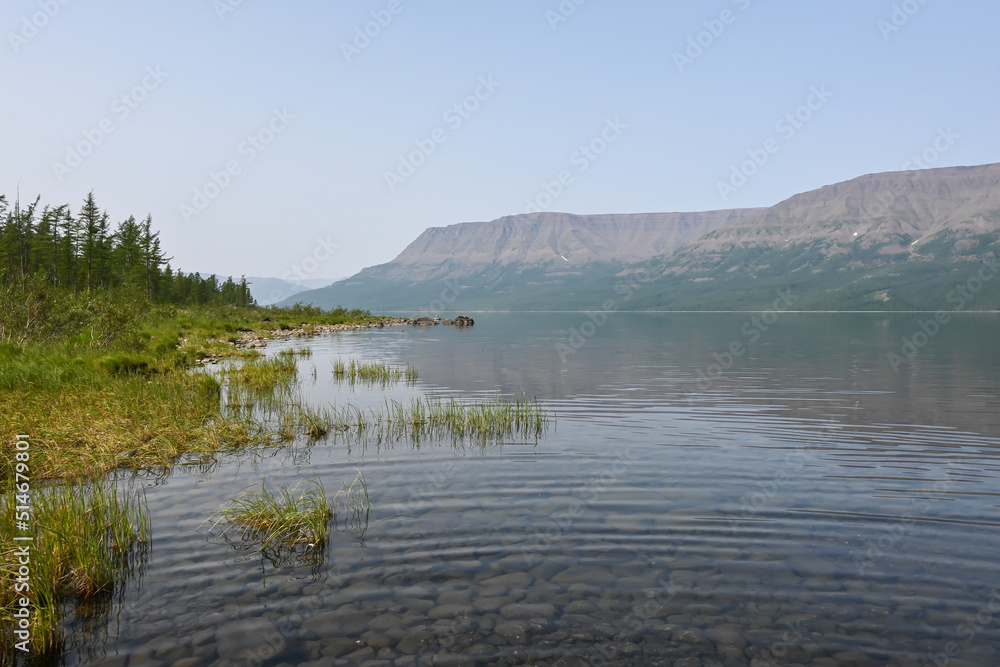 A mountain lake in a misty haze. A mountain lake in a misty haze.
