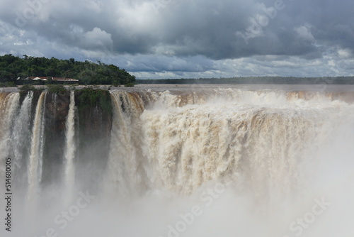 The photo shows a stunning view from the top of the Iguazu Falls     a complex of 275 waterfalls on the Iguazu River  located on the border of Brazil and Argentina