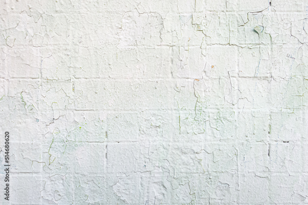 abstract background of an old shabby painted white tiled concrete wall close up abstract background of an old shabby painted white tiled concrete wall close up