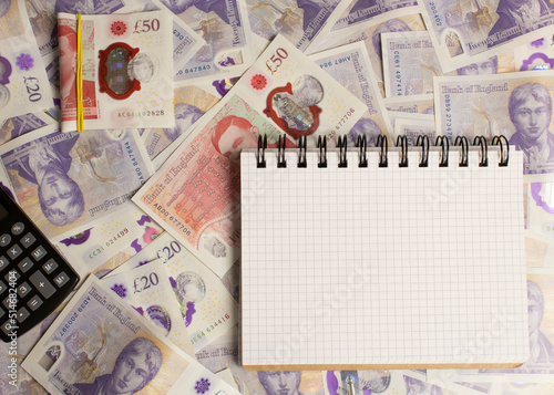 british money and calculator, notepad photo