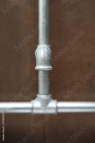 Zinc tap and water pipe in the bathroom.