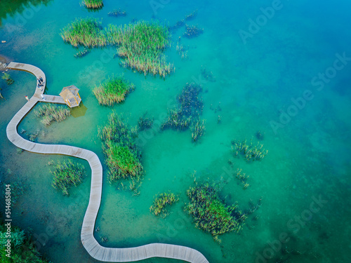 Turquiose Water and Wooden Bridge. Aerial Landscape. Park Grodek in Jaworzno, Poland. Polish Maldives.