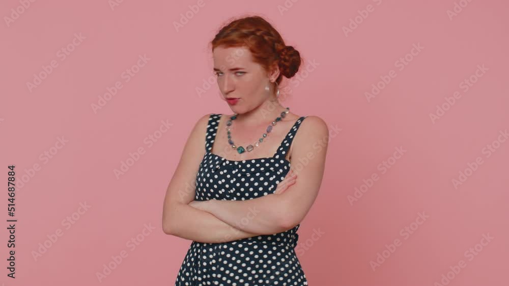 Dissatisfied woman shaking head no, asking reason of failure, expressing disbelief irritation, feeling bored, disappointed in result, bad news. Ginger girl isolated alone on pink studio background Dissatisfied woman shaking head no, asking reason of failure, expressing disbelief irritation, feeling bored, disappointed in result, bad news. Ginger girl isolated alone on pink studio background