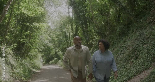 Active Mature Couple Walking in Forrest Together