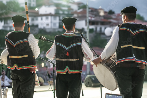 Unidentified Macedonian musicians in traditional costumes perform at folk music festival in Northern Macedonia.