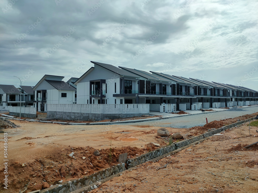 SEREMBAN, MALAYSIA -MARCH 4, 2021: Selected focused on double story terrace house under construction in Malaysia. Designed by an architect with a modern and suite with tropical climate. 
