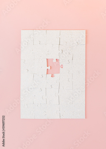 Canvas Print Creative concept made of puzzles where one is missing on a pink background