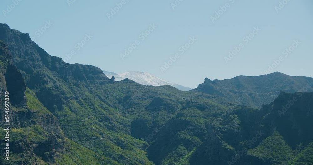 Masca Gorge. Volcanic green landscape of Tenerife, snowy peak of volcano Teide. Canary Islands, Spain. Masca Gorge. Volcanic green landscape of Tenerife, snowy peak of volcano Teide. Canary Islands, Spain.