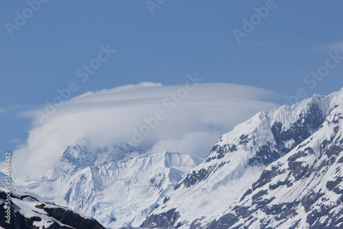 Orbital cloud formation (lenticular clouds) around an Alaskan mountain