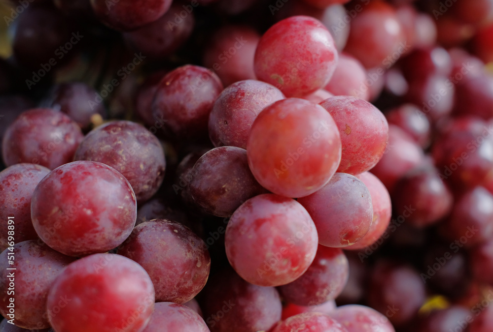 Grapes - Grapes in baskets in bulk. Close-up detail of grapes Grapes - Grapes in baskets in bulk. Close-up detail of grapes