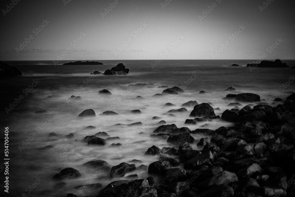 Rocky coast with blurred waves 