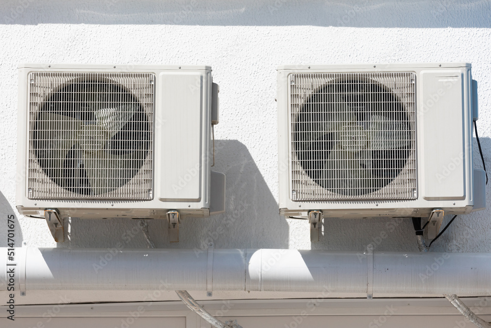 cooling unit for duct air conditioner hanging on the wall of the building cooling unit for duct air conditioner hanging on the wall of the building