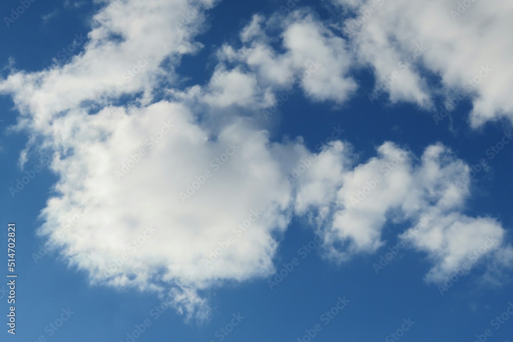 Beautiful fluffy clouds in blue sky, natural background Beautiful fluffy clouds in blue sky, natural background