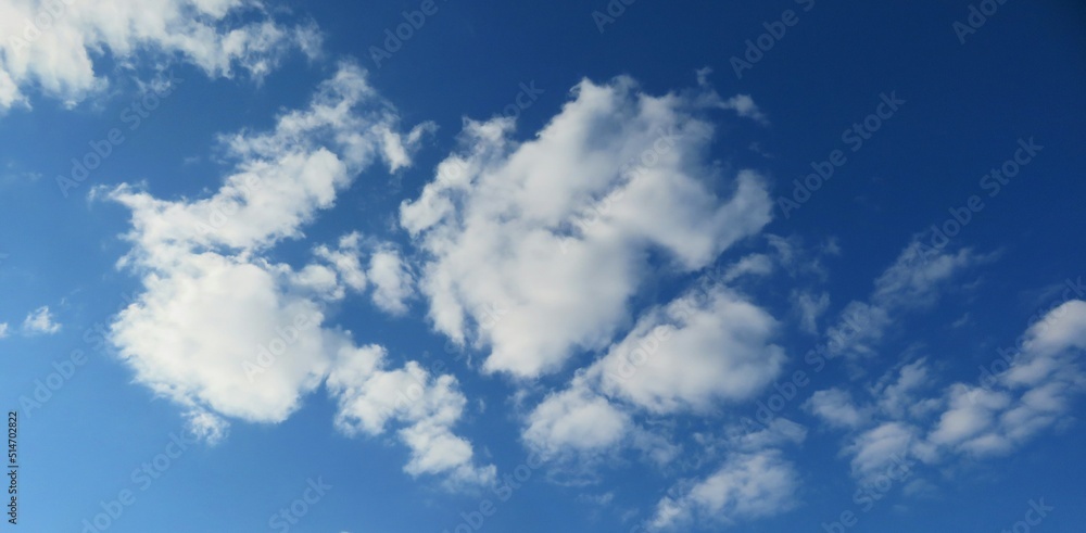 Fototapeta premium Beautiful fluffy clouds in blue sky