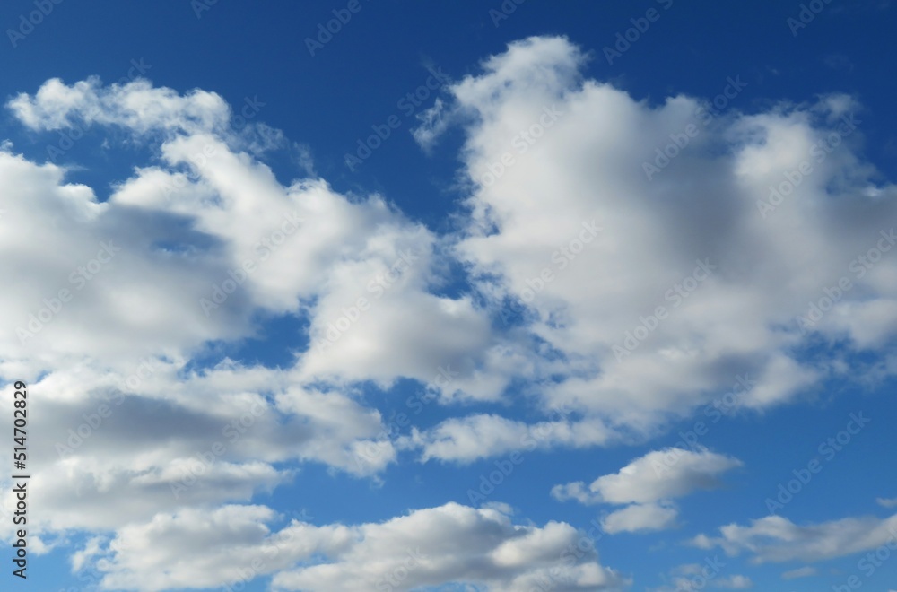 Beautiful fluffy clouds in blue sky, natural background Beautiful fluffy clouds in blue sky, natural background