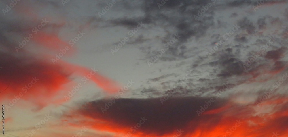 Panoramic view on fiery sunset on the sky Panoramic view on fiery sunset on the sky