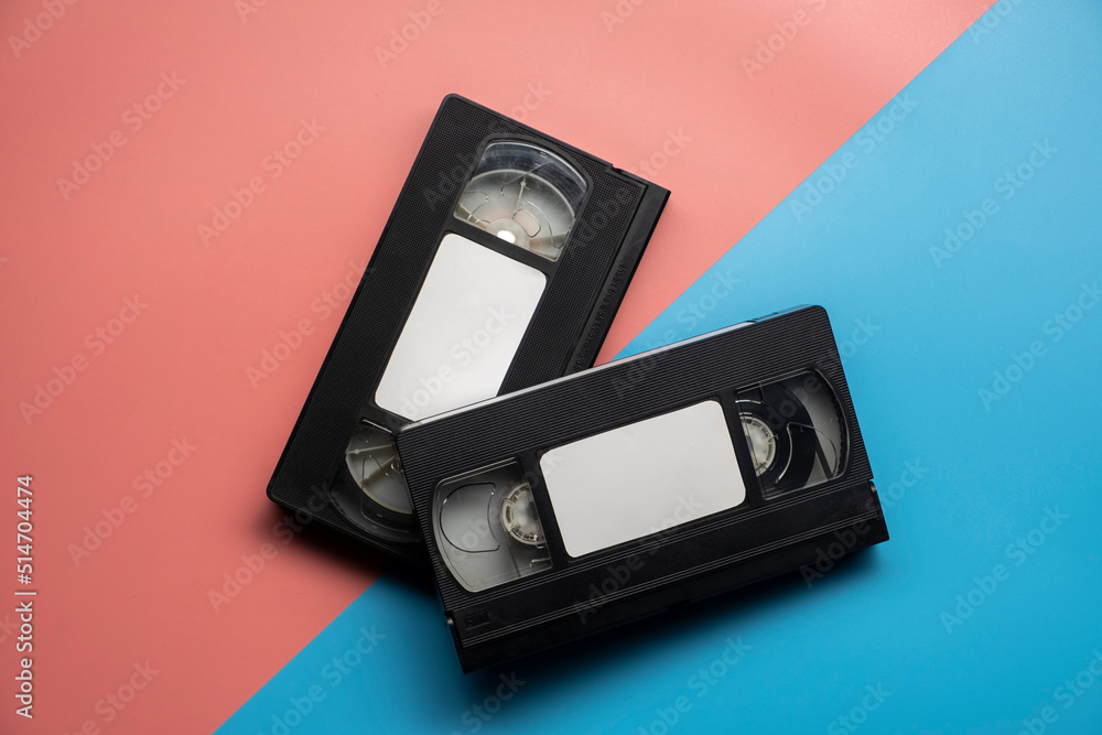 Old video tape on colorful background. VHS video tape. Retro, vintage concept. Old video tape on colorful background. VHS video tape. Retro, vintage concept.
