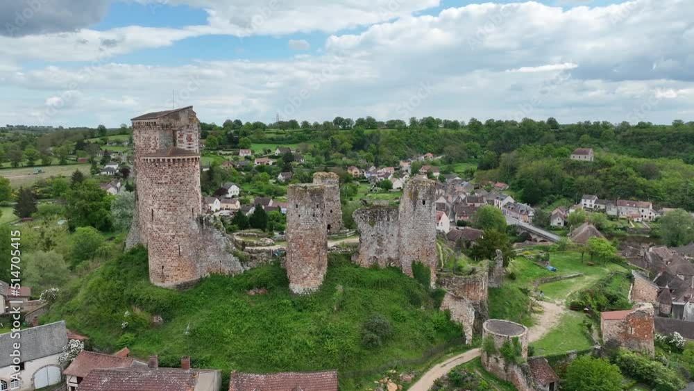 Aerial view of the ruins of Herisson fortress of the Dukes of Bourbon dominate the medieval city of Hérisson and Aumance Valley with towers standing tall in the inner castle in central France Aerial view of the ruins of Herisson fortress of the Dukes of Bourbon dominate the medieval city of Hérisson and Aumance Valley with towers standing tall in the inner castle in central France