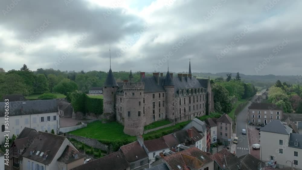 Aerial panoramic view of Lapalisse castle in the Allier department of the Auvergne-Rhône-Alpes in France with Renaissance wing from rose colored brick, Gothic chapel Aerial panoramic view of Lapalisse castle in the Allier department of the Auvergne-Rhône-Alpes in France with Renaissance wing from rose colored brick, Gothic chapel