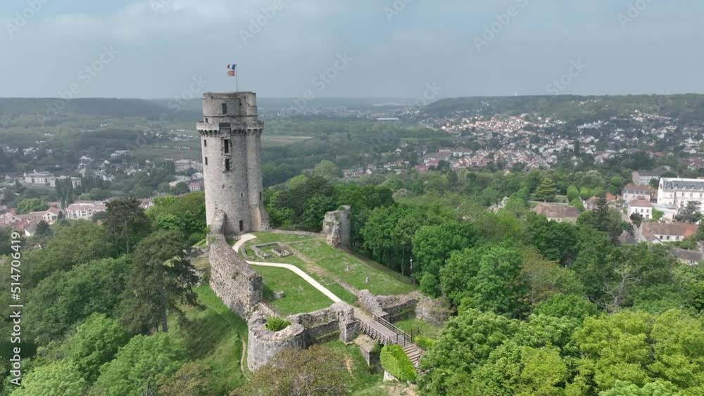 Aerial view of medieval ruined Montlhéry castle controlling the Paris - Orleans road with prominent keep towering over the hill in Central France Aerial view of medieval ruined Montlhéry castle controlling the Paris - Orleans road with prominent keep towering over the hill in Central France