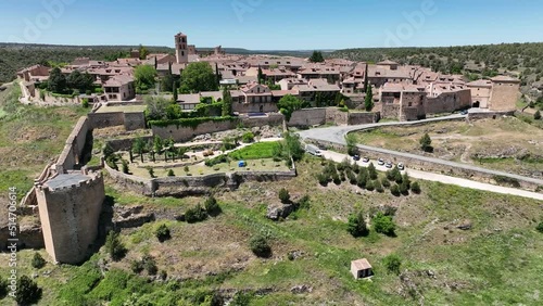 Panning video around the medieval picture perfect town of Pedraza near Segovia in Spain with city gate, towers, bastions, Gothic church popular tourist destination photo