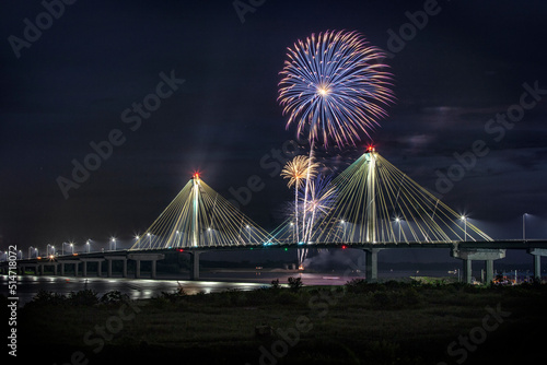 Fototapeta Naklejka Na Ścianę i Meble -  July 4th USA independence celebration fireworks  on top of Clark Bridge in the border of Missouri and Illinois, USA
