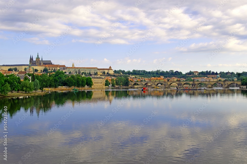 Panoramic reflections of Prague City Castle and Charles Bridge.