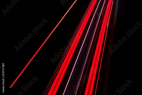 Night traffic. Streaks of tail lights at a long exposure. Geometric abstract