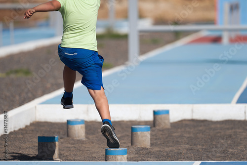 Photography Mud race runners. The chid overcoming the obstacle