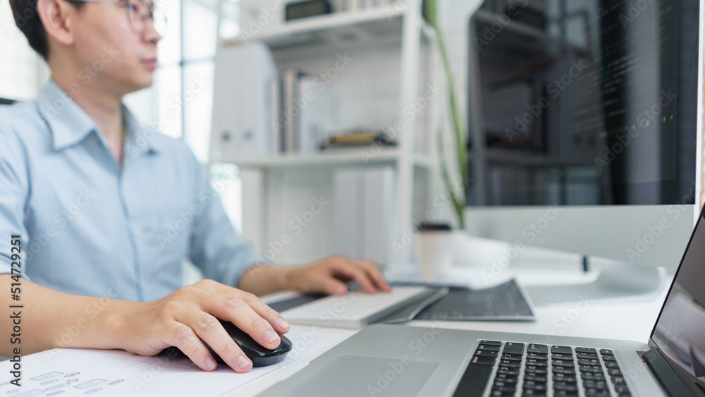 Software development concept, Male programmer typing data code on laptop to develop app and website Software development concept, Male programmer typing data code on laptop to develop app and website