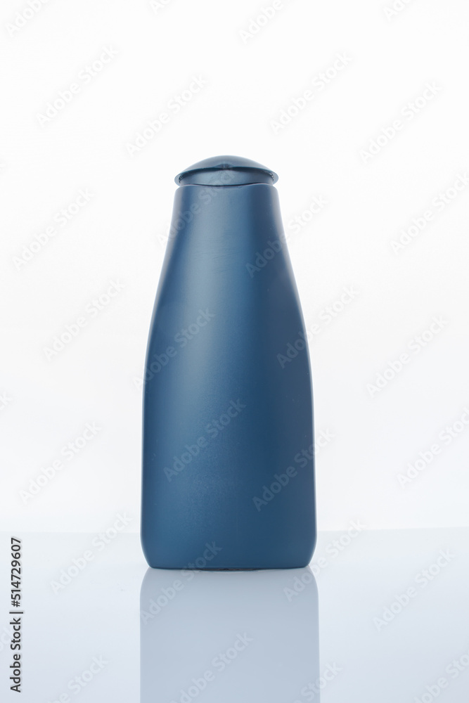 Blue plastic shampoo bottle on a white background Blue plastic shampoo bottle on a white background