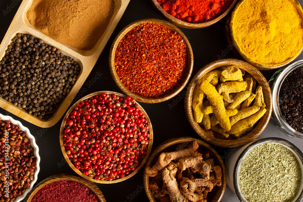 various spices on black background