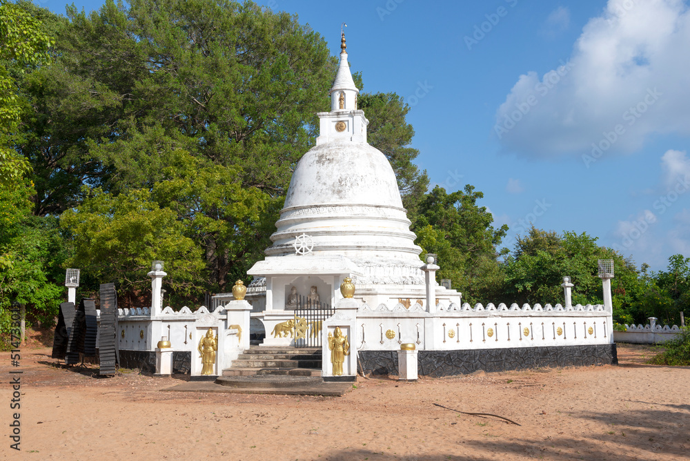Buddhist stupa in the grounds of the Vijayangarama Temple on a sunny day. Trincomalee Buddhist stupa in the grounds of the Vijayangarama Temple on a sunny day. Trincomalee