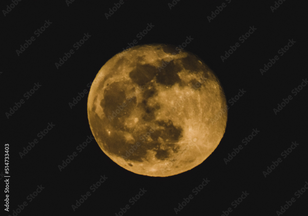 Fototapeta premium The full moon hanging in the sky over Orwell, Ohio