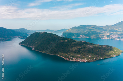 Beautiful aerial view of Torbole, Lake Garda (Lago di Garda) and the mountains, Italy. Scenic aerial view of Riva del Garda town, located on a shore of Garda lake. 