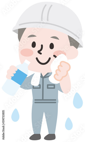 熱中症予防に水を飲む作業員