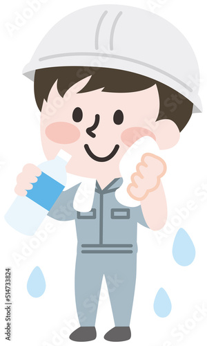 熱中症予防に水を飲む作業員