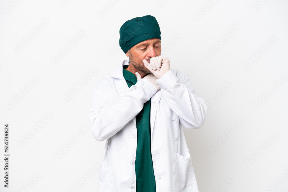 Middle age surgeon in green uniform isolated on white background is suffering with cough and feeling bad Middle age surgeon in green uniform isolated on white background is suffering with cough and feeling bad