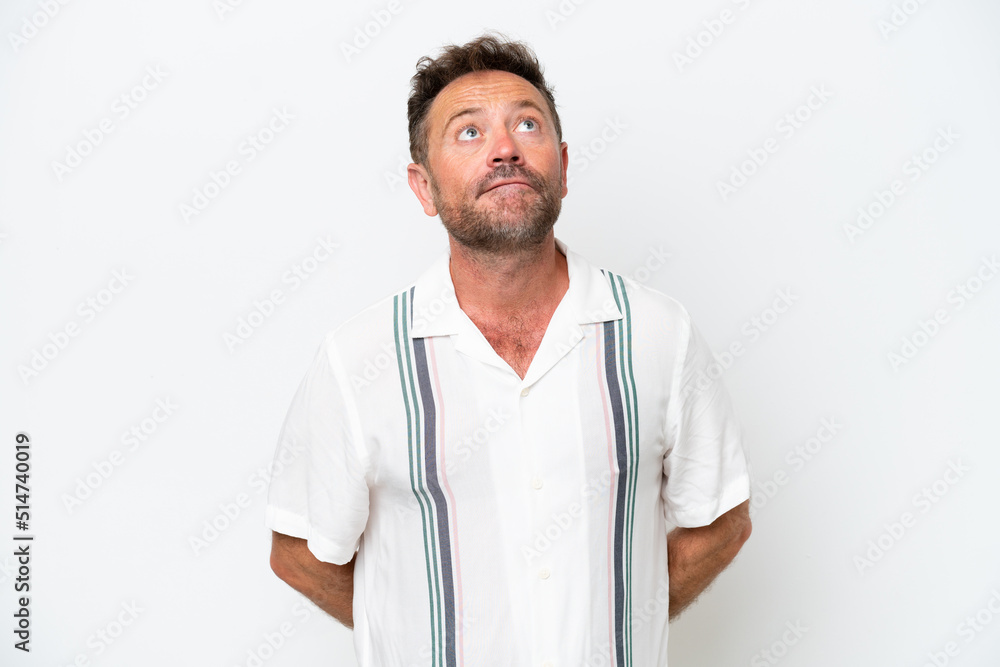 Fototapeta premium Middle age caucasian man isolated on white background and looking up