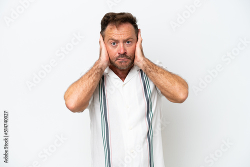 Middle age caucasian man isolated on white background frustrated and covering ears © luismolinero