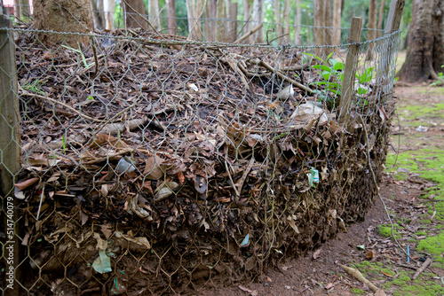 Compost fertiliser, dried leaves and manure in a net