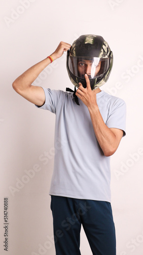 Indian collage boy wears black helmet or head protection gear for safety on white background with different expressions also person pointing by hand to helmet copy space proud and confident
