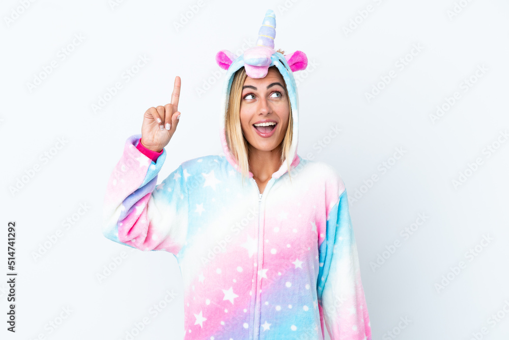 Blonde Uruguayan girl wearing a unicorn pajama isolated on white background intending to realizes the solution while lifting a finger up