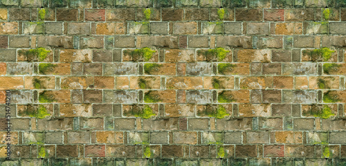 old brick wall covered with green moss, stone wall of an old house © Kai Beercrafter