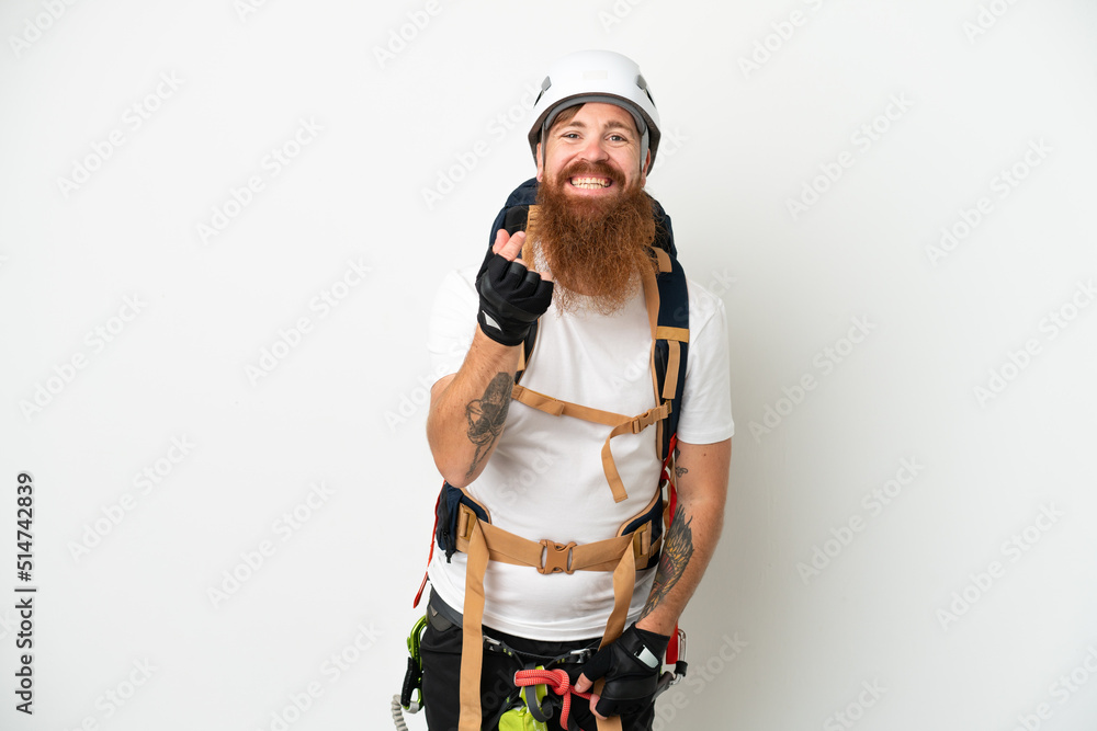 Young rock- climber reddish caucasian man isolated on white background making money gesture Young rock- climber reddish caucasian man isolated on white background making money gesture