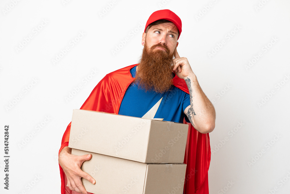 Super Hero delivery reddish man isolated on white background having doubts Super Hero delivery reddish man isolated on white background having doubts