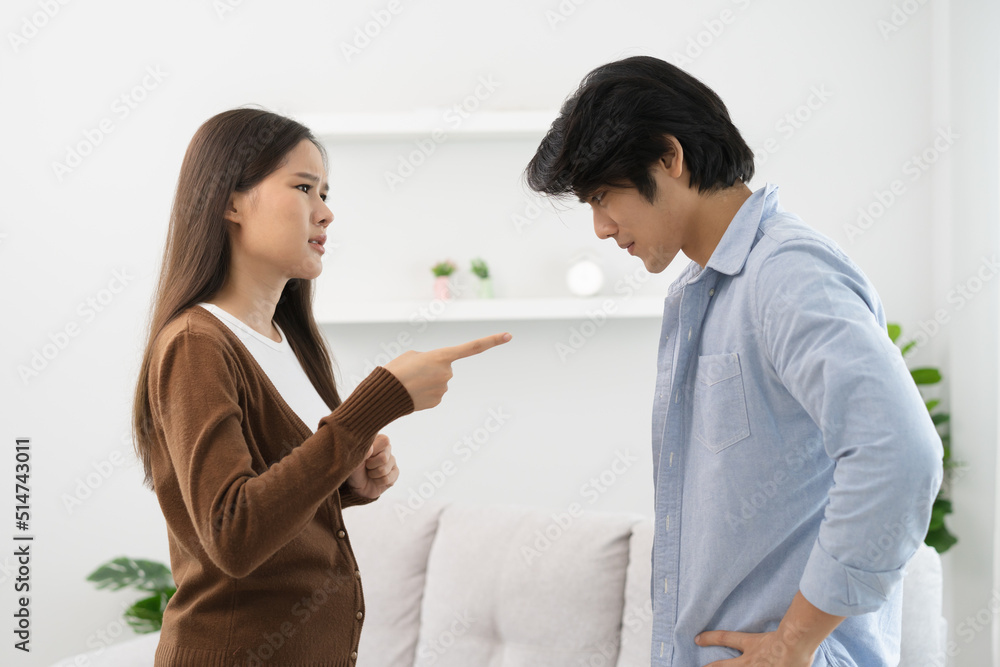 Family problems, Asian couple quarrel together at home. woman angry on man and man feel annoy. Family problems, Asian couple quarrel together at home. woman angry on man and man feel annoy.