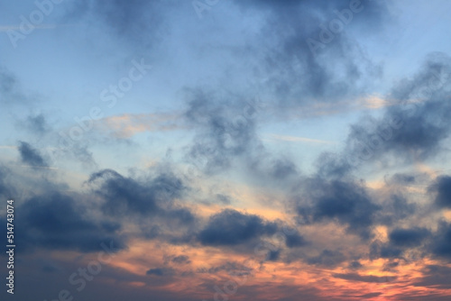 stunning evening sky, blue rainy clouds and sunlight