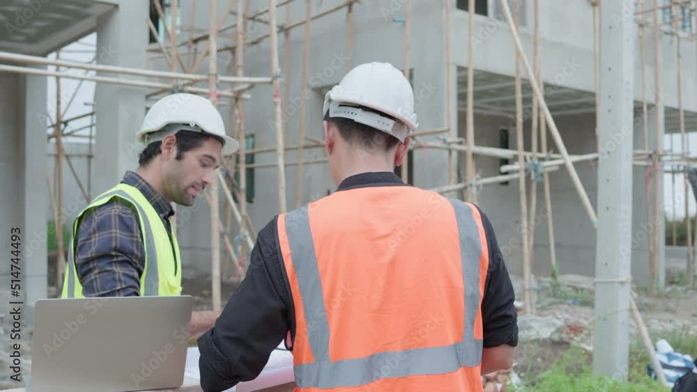 Professional male civil engineers manager or architects and foreman, worker. While meeting discuss inspect with laptop, blueprint building project on construction site. Real estate building concept. Professional male civil engineers manager or architects and foreman, worker. While meeting discuss inspect with laptop, blueprint building project on construction site. Real estate building concept.