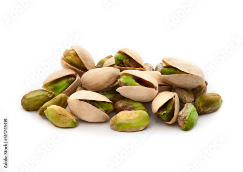 Pistachio nuts. Many pistachios isolated on white. photo